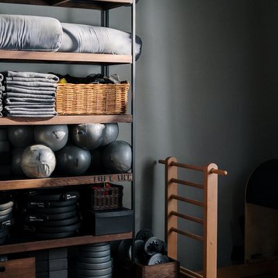A neat stack of yoga towels in a gym.
